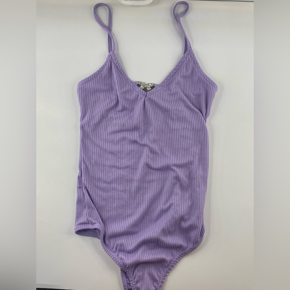 Purple body suit with butterfly emblem